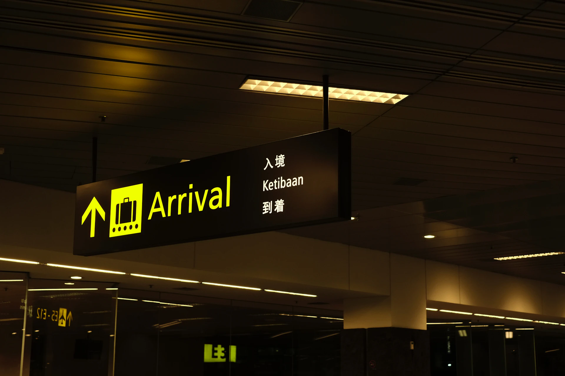 Driver holding a name board at airport arrivals