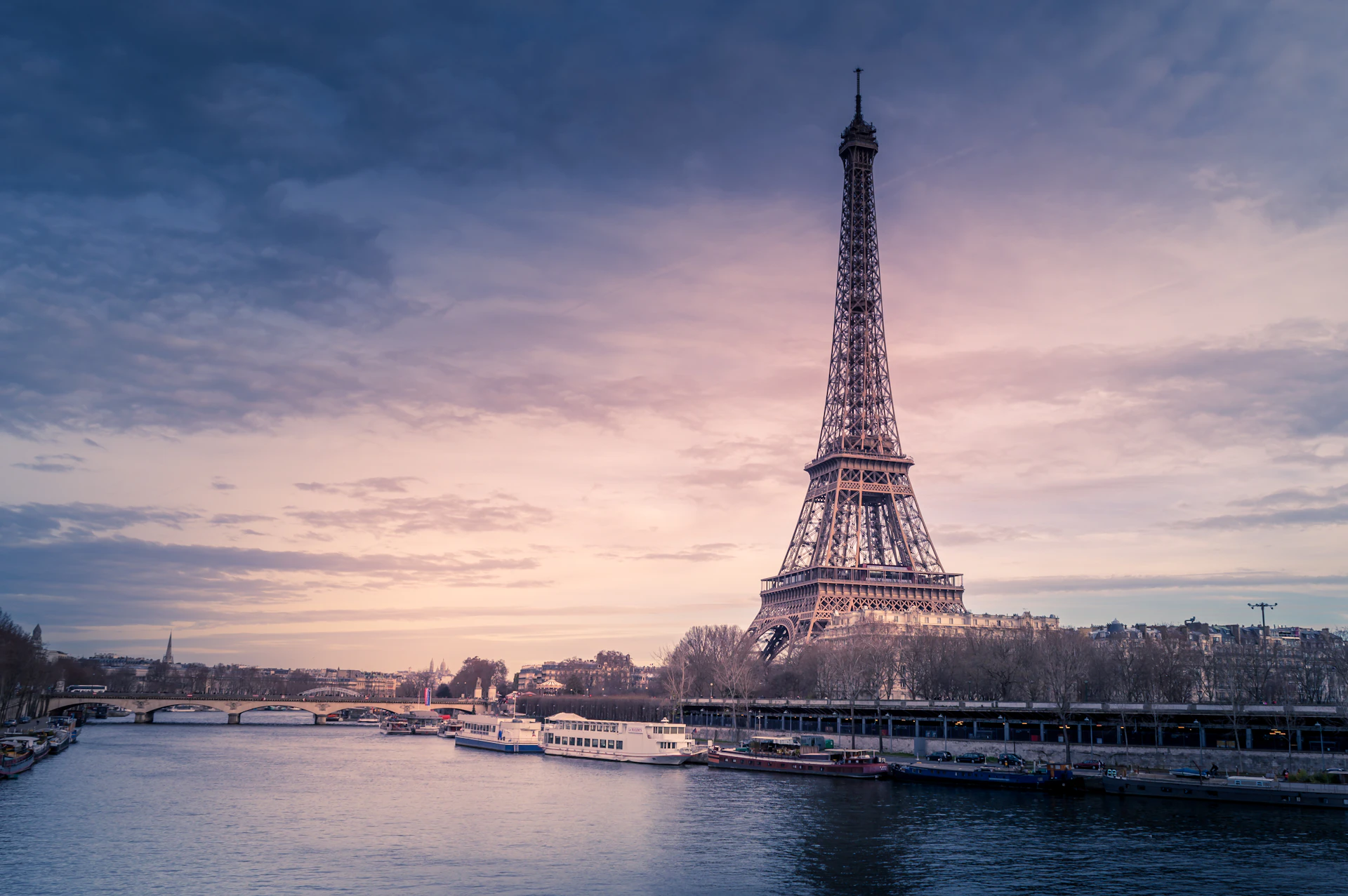 View of the Eiffel Tower from a passing taxi at dusk